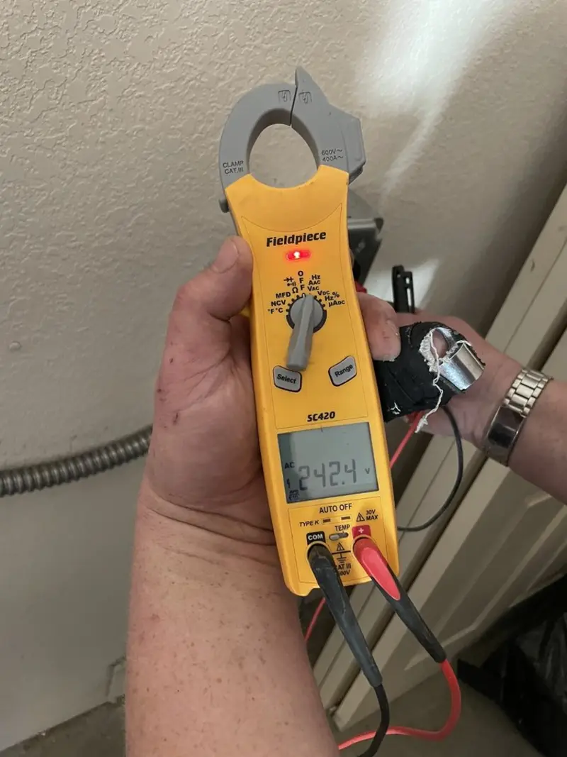 Voltage testing with clamp meter during Recessed Lighting Installation in Rosedale